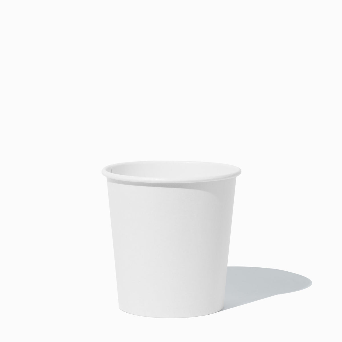 Compostable white pint to-go containers stacked and ready to serve