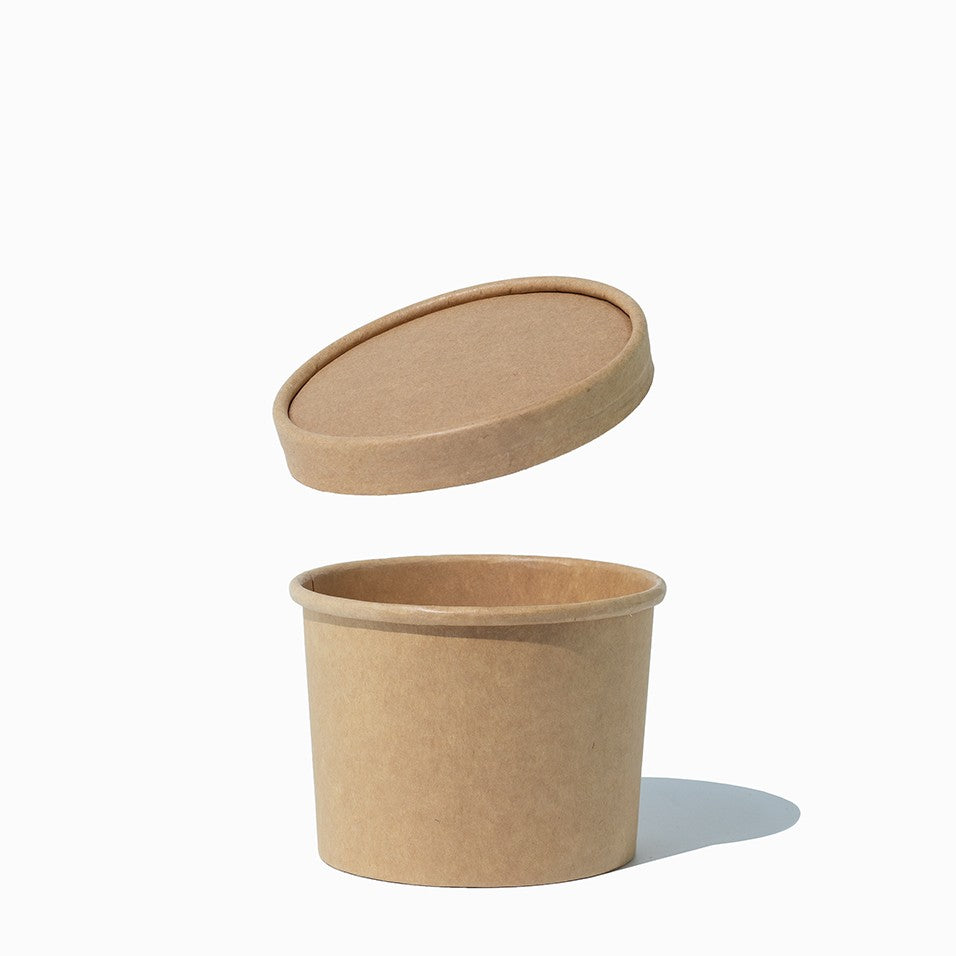 Close-up of kraft paper cup lids stacked and ready to serve