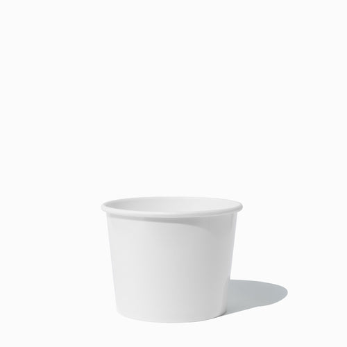 Close-up of 12 oz white to-go containers stacked and ready to serve