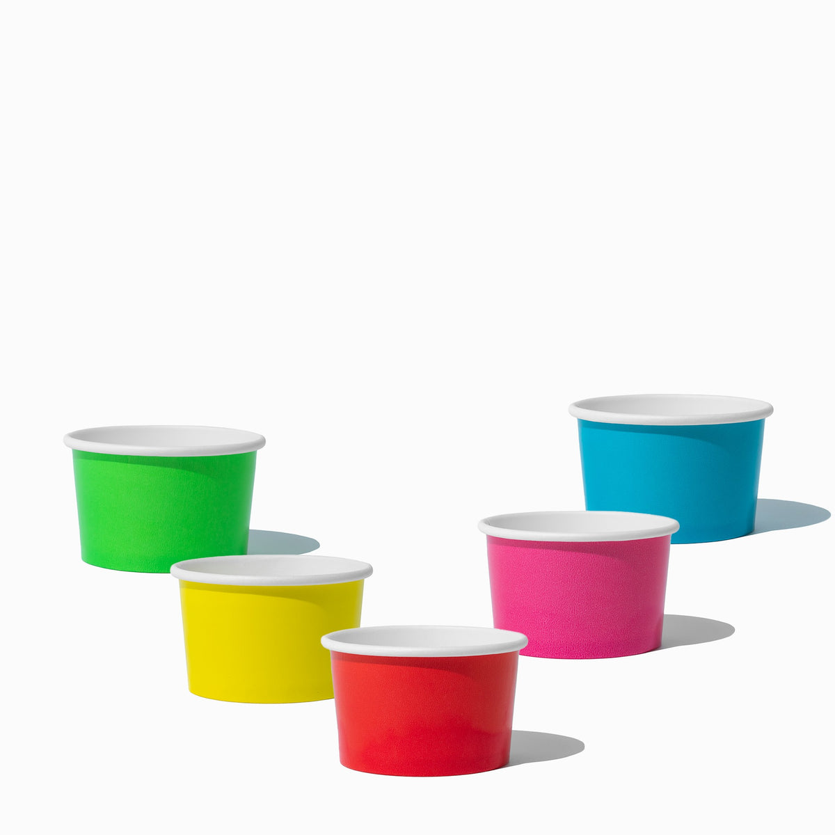 Close-up of 4 oz assorted paper ice cream cups stacked and ready to serve