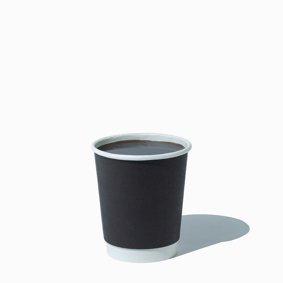 Close-up of 8 oz black paper ice cream cups stacked and ready to serve