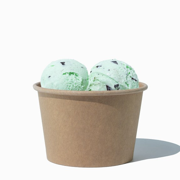 Close-up of 8 oz kraft compostable ice cream cups stacked and ready to serve