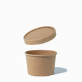 Close-up of 8 oz kraft compostable to-go containers stacked and ready to serve