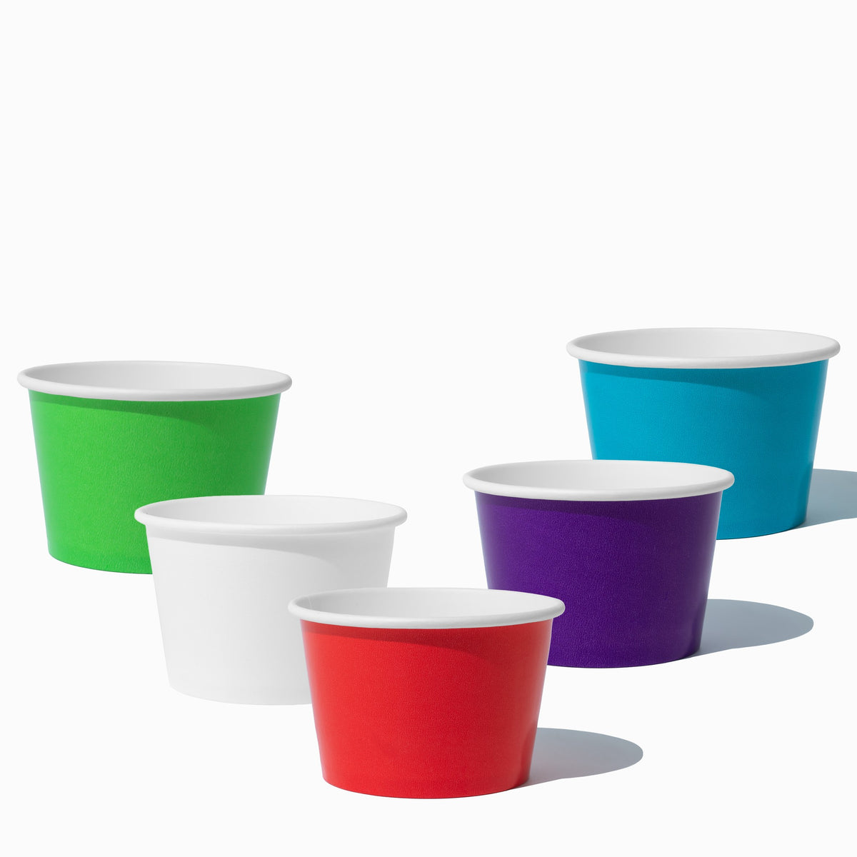 Close-up of 8 oz assorted paper ice cream cups stacked and ready to serve