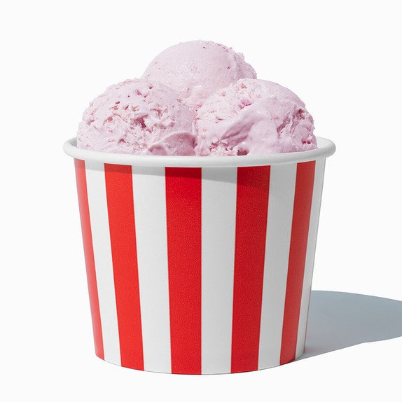 Close-up of 12 oz red ice cream cups stacked and ready to serve