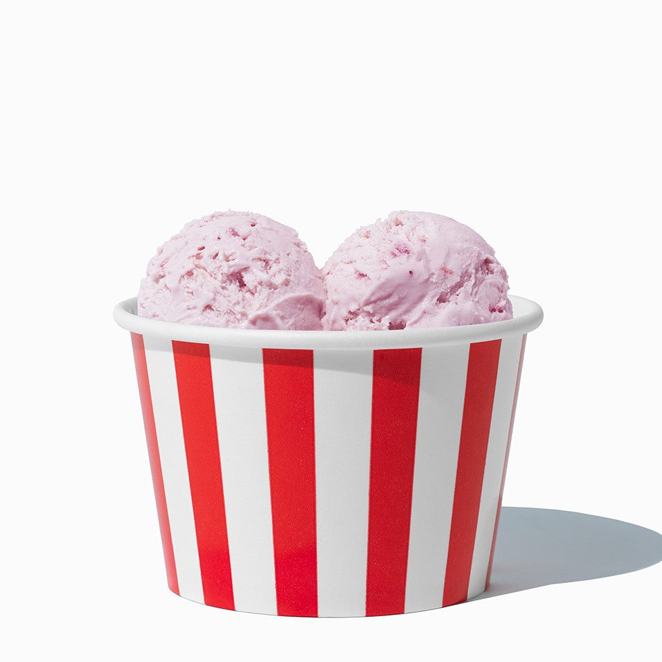 Close-up of 8 oz red ice cream cups stacked and ready to serve