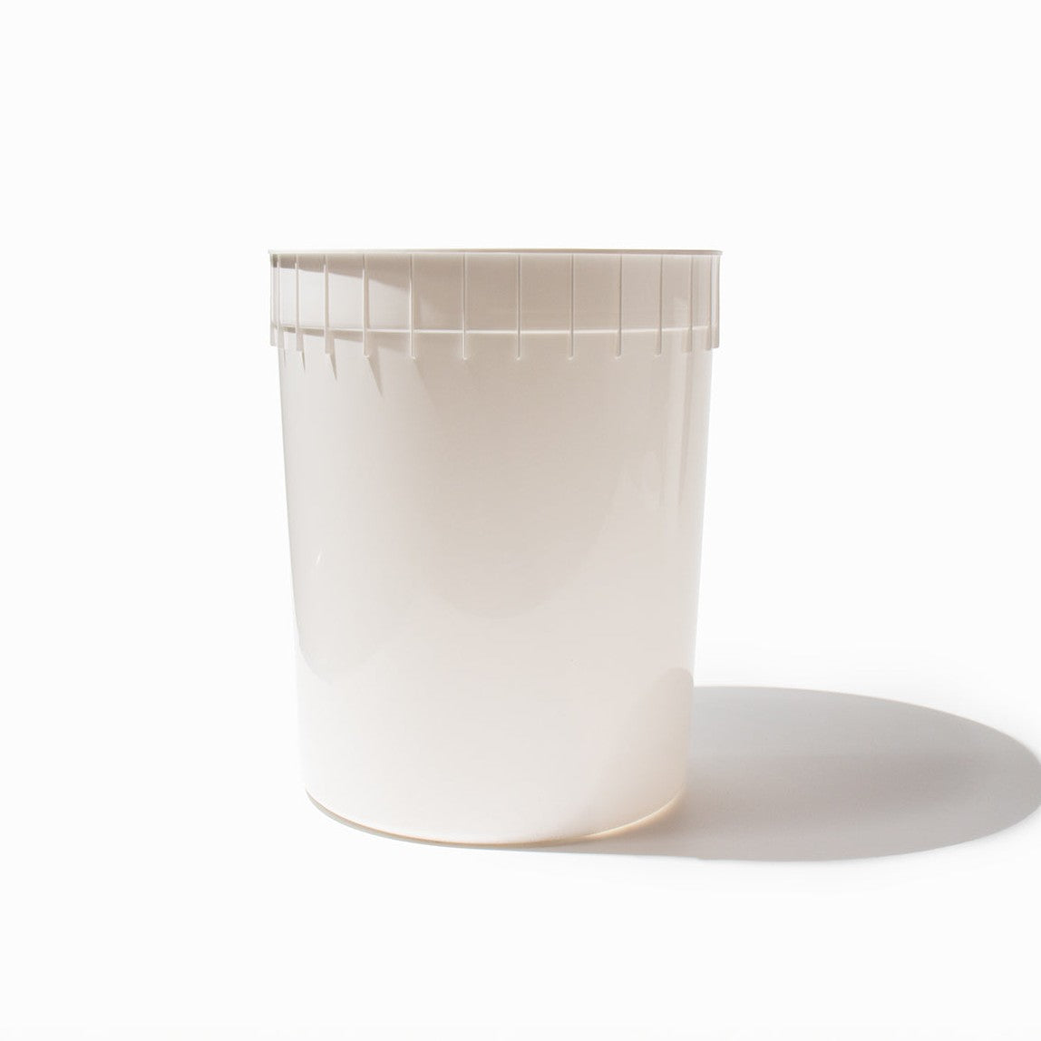 Close-up of 3 Gallon white plastic ice cream tubs stacked and ready to serve