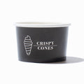 Close-up of 4 oz ice cream cups stacked and ready to serve