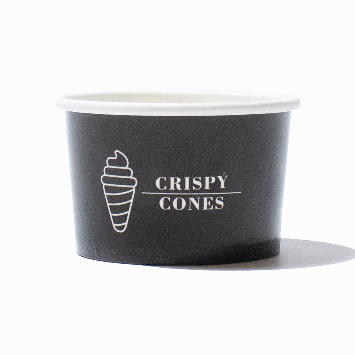 Close-up of 4 oz ice cream cups stacked and ready to serve