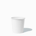Close-up of 1 Pint white paper to-go containers stacked and ready to serve