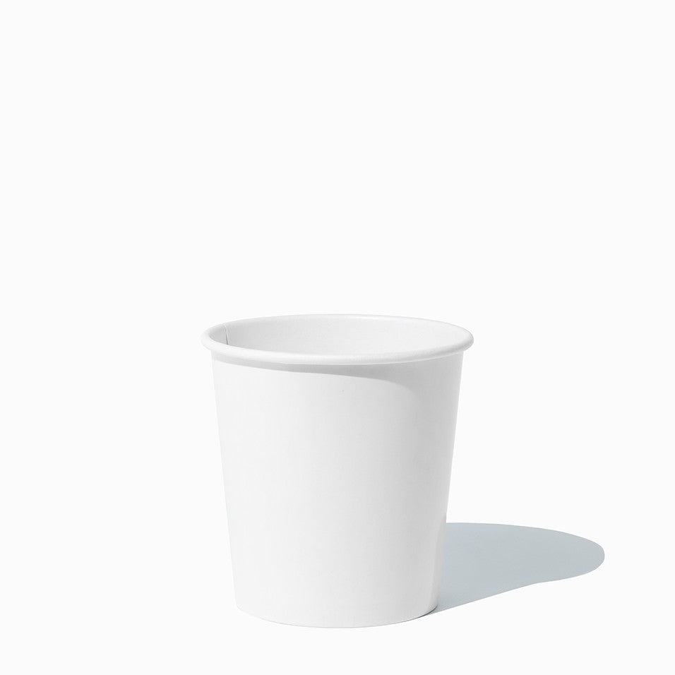 Close-up of 1 Pint white paper to-go containers stacked and ready to serve