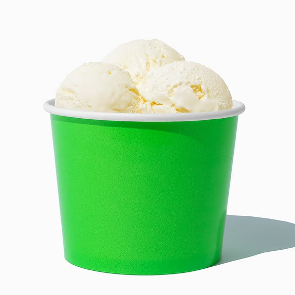Close-up of 12 oz green ice cream cups stacked and ready to serve