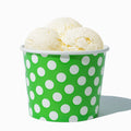 Close-up of 12 oz green ice cream cups stacked and ready to serve