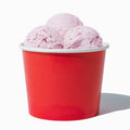 Close-up of 12 oz red ice cream cups stacked and ready to serve