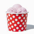Close-up of 12 oz red ice cream cups stacked and ready to serve