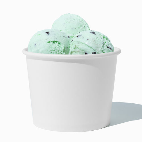 Close-up of 12 oz white paper ice cream cups stacked and ready to serve