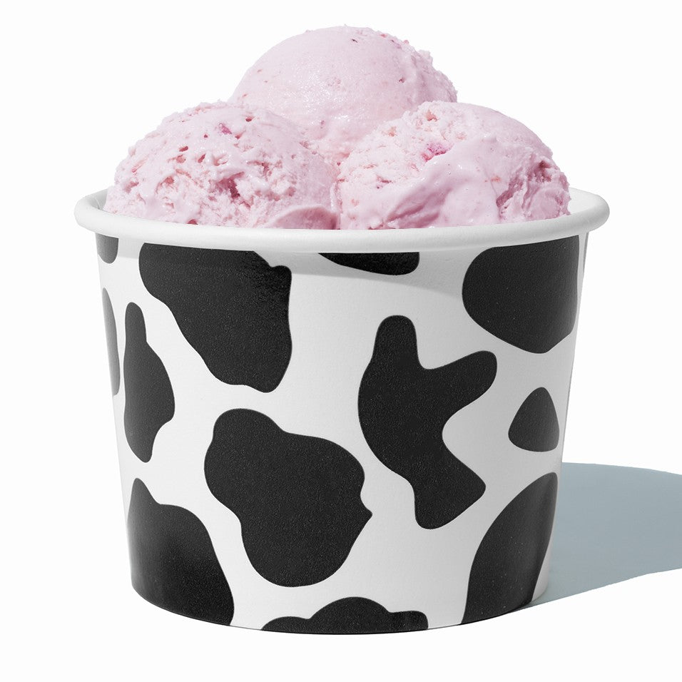 Close-up of 16 oz black ice cream cups stacked and ready to serve