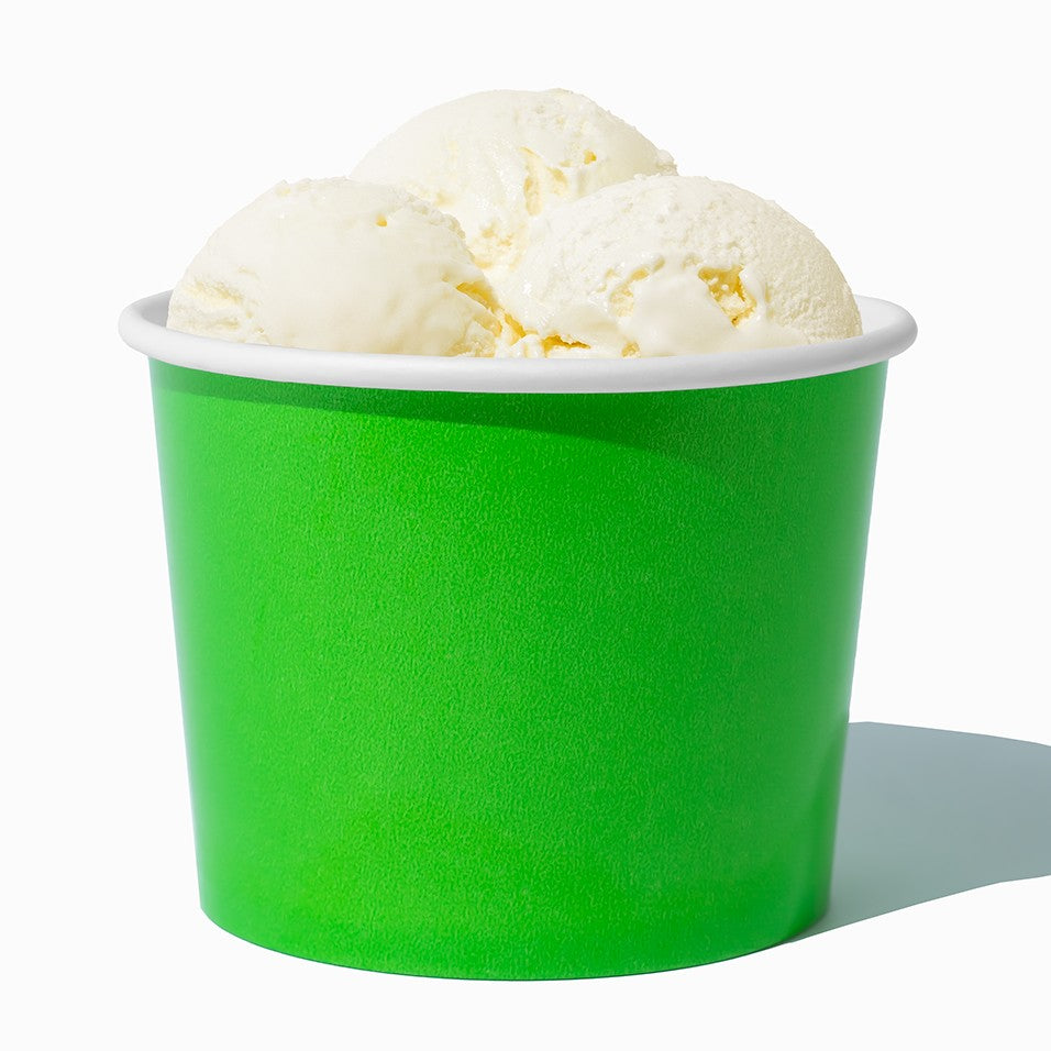 Close-up of 16 oz green ice cream cups stacked and ready to serve