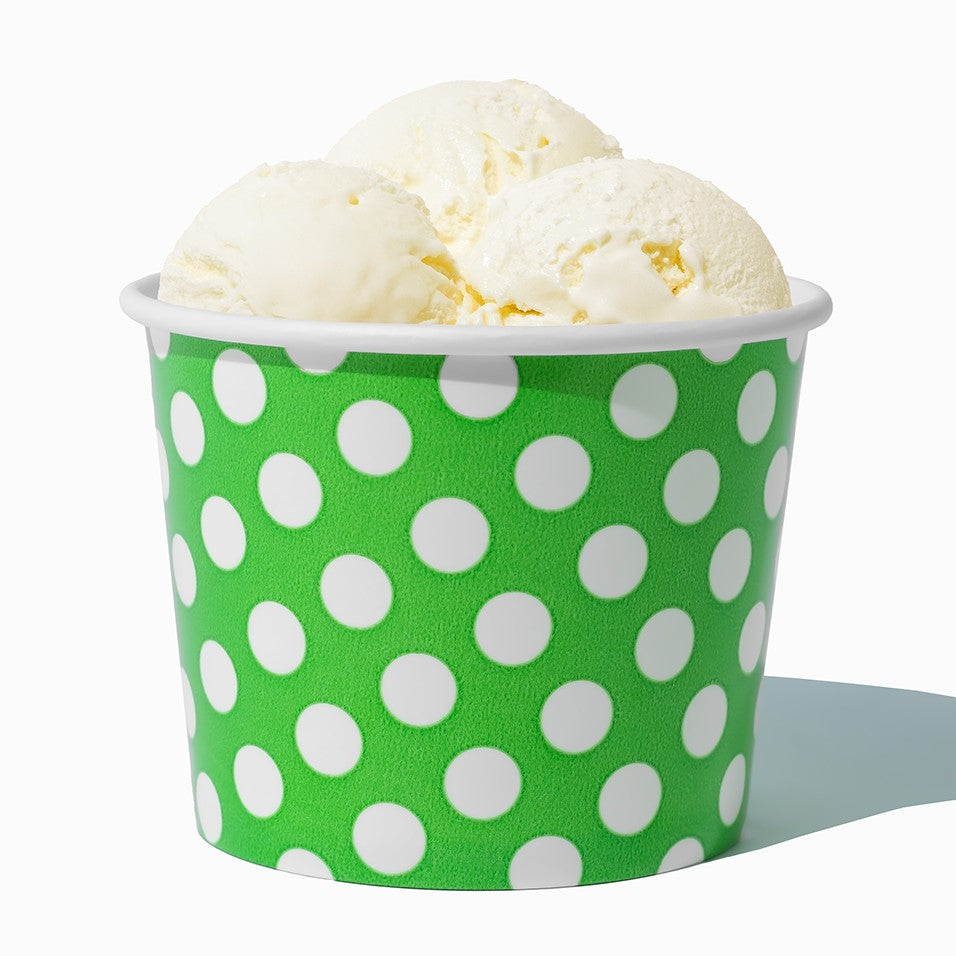 Close-up of 16 oz green ice cream cups stacked and ready to serve