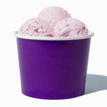 Close-up of 16 oz purple ice cream cups stacked and ready to serve
