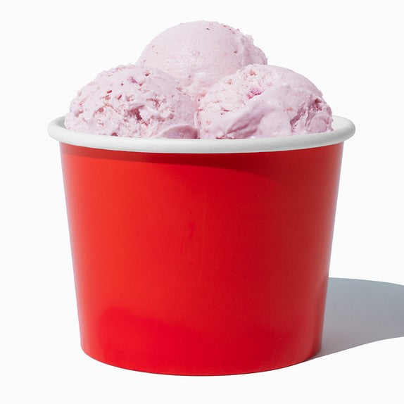 Close-up of 16 oz red ice cream cups stacked and ready to serve