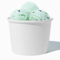 Close-up of 16 oz white paper ice cream cups stacked and ready to serve
