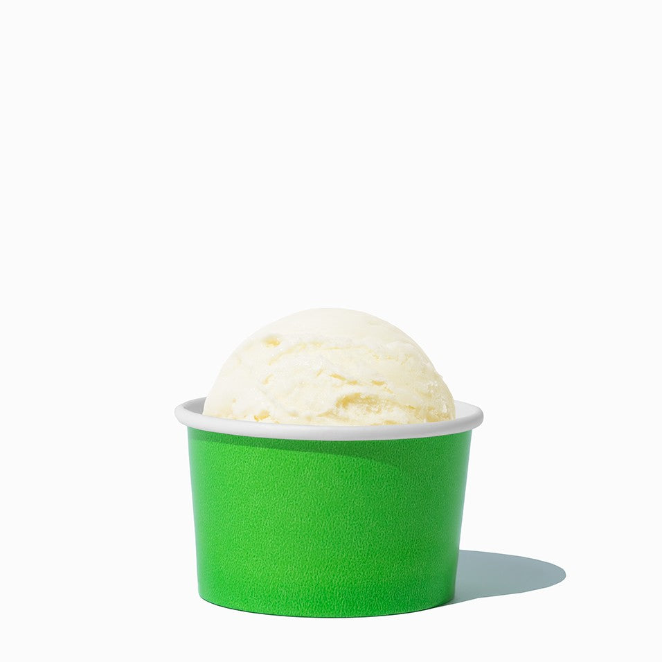 Close-up of 3 oz green ice cream cups stacked and ready to serve