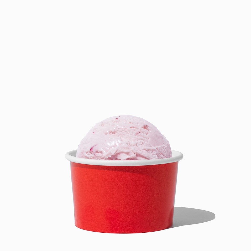 Close-up of 3 oz red paper ice cream cups stacked and ready to serve