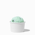 Close-up of 3 oz white paper ice cream cups stacked and ready to serve