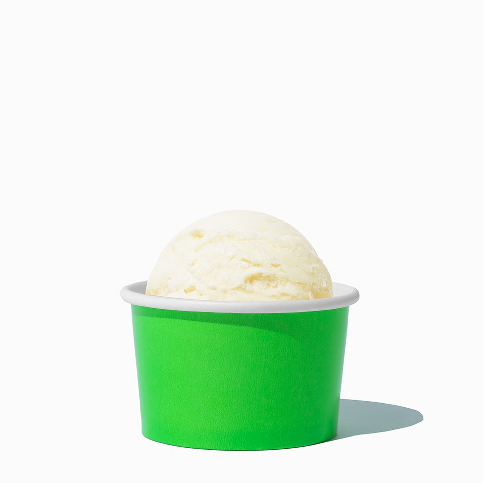 Close-up of 4 oz green ice cream cups stacked and ready to serve