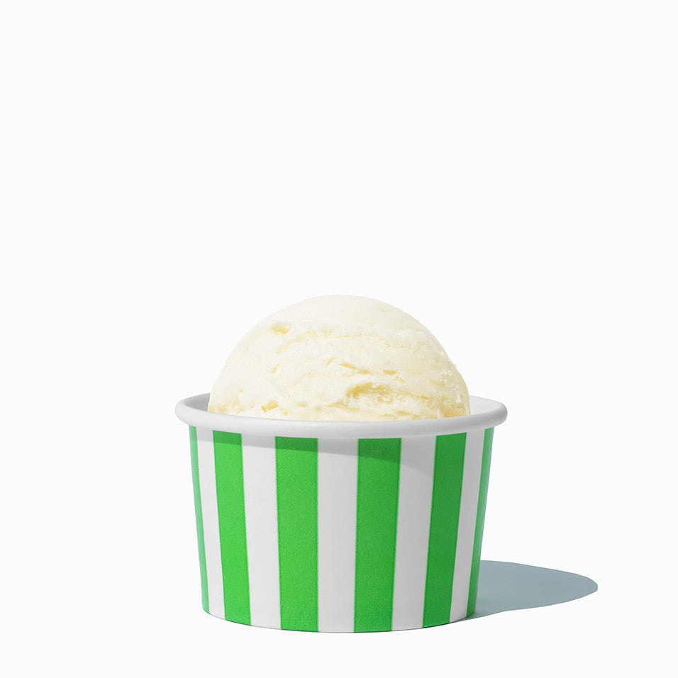 Close-up of 4 oz green ice cream cups stacked and ready to serve