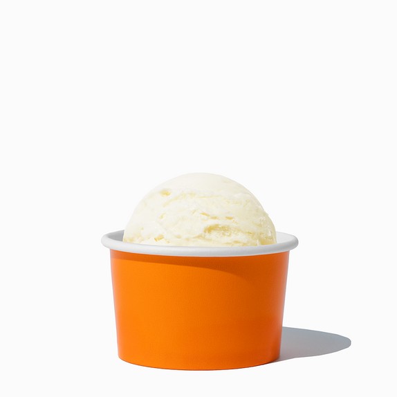 Close-up of 4 oz orange ice cream cups stacked and ready to serve
