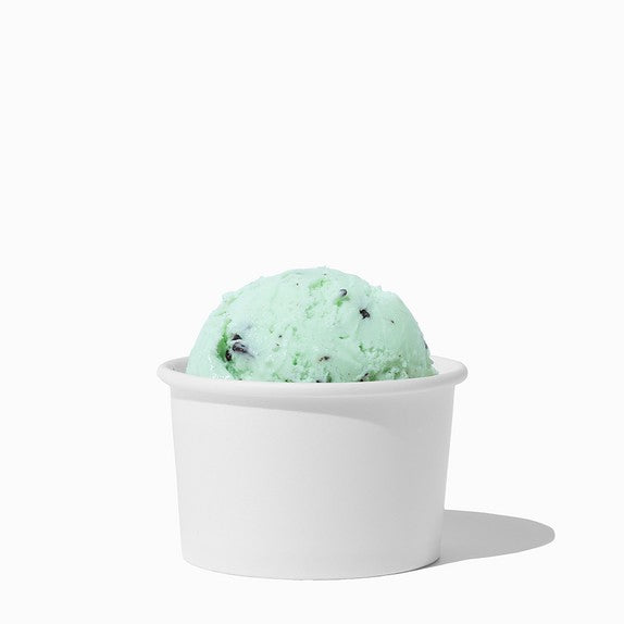 Close-up of 4 oz white ice cream cups stacked and ready to serve