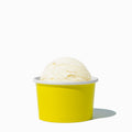 Close-up of 4 oz yellow ice cream cups stacked and ready to serve