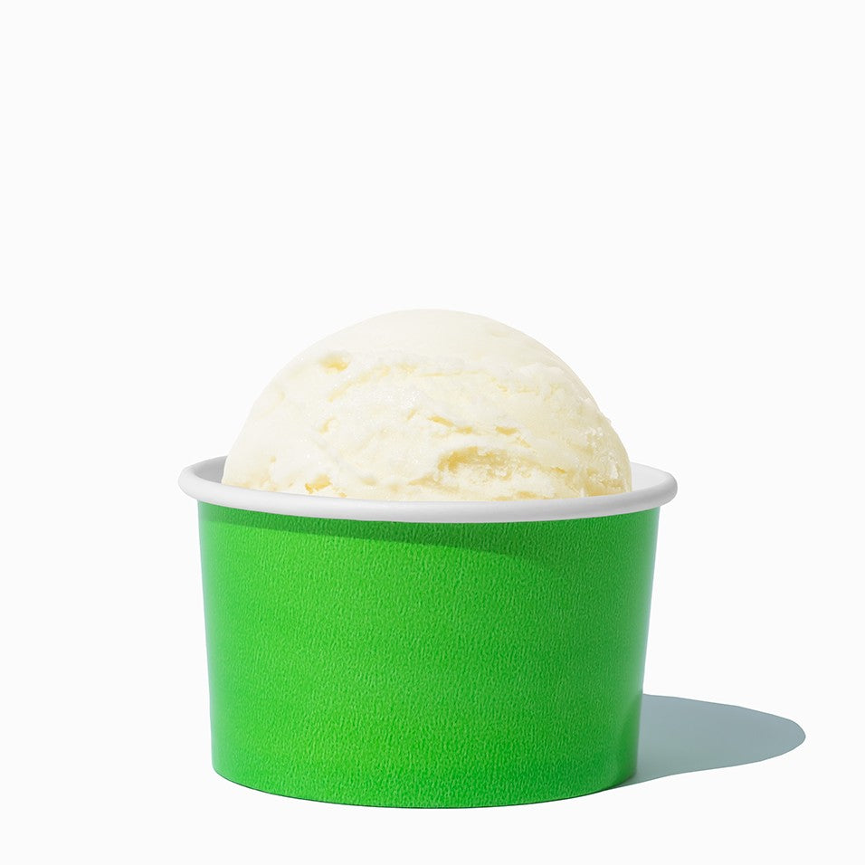 Close-up of 5 oz green ice cream cups stacked and ready to serve