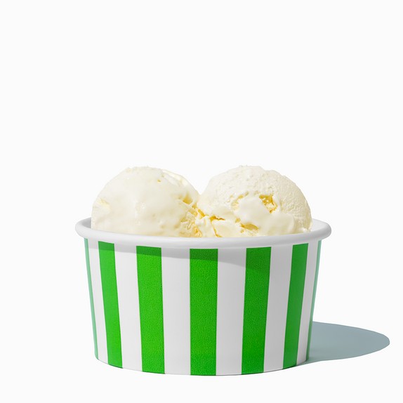 Close-up of 6 oz green ice cream cups stacked and ready to serve