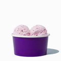 Close-up of 6 oz purple paper ice cream cups stacked and ready to serve