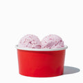 Close-up of 6 oz red ice cream cups stacked and ready to serve