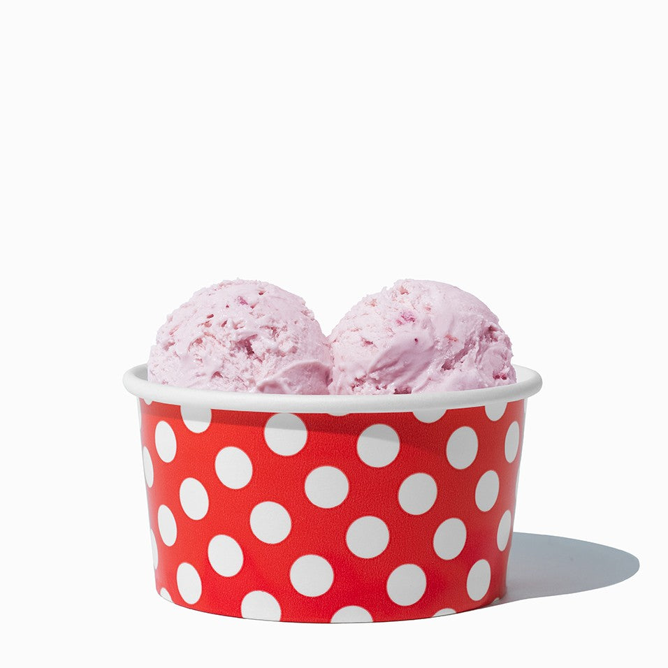 Close-up of 6 oz red ice cream cups stacked and ready to serve