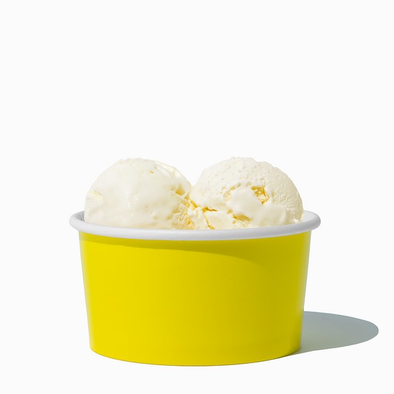 Close-up of 6 oz yellow ice cream cups stacked and ready to serve