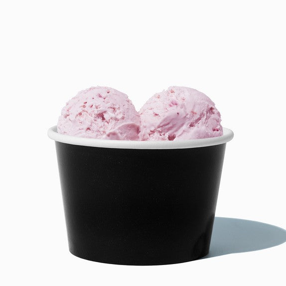 Close-up of 8 oz black ice cream cups stacked and ready to serve