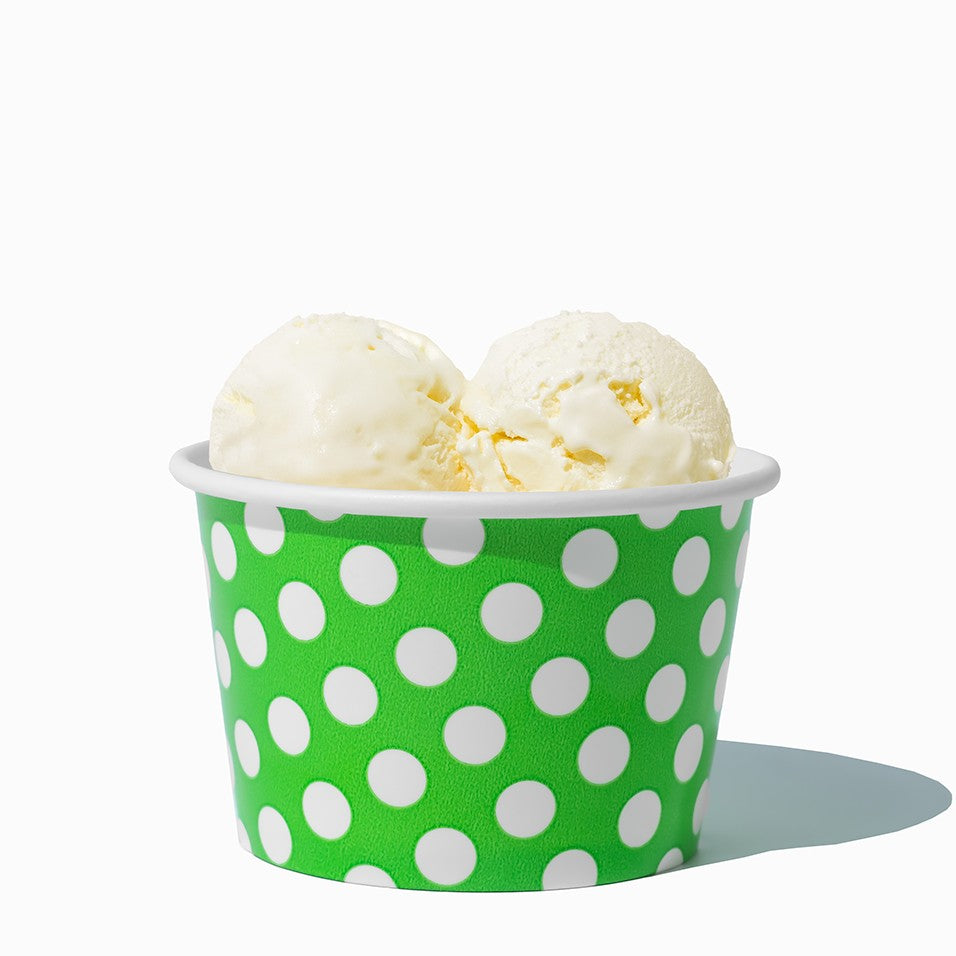 Close-up of 8 oz green ice cream cups stacked and ready to serve