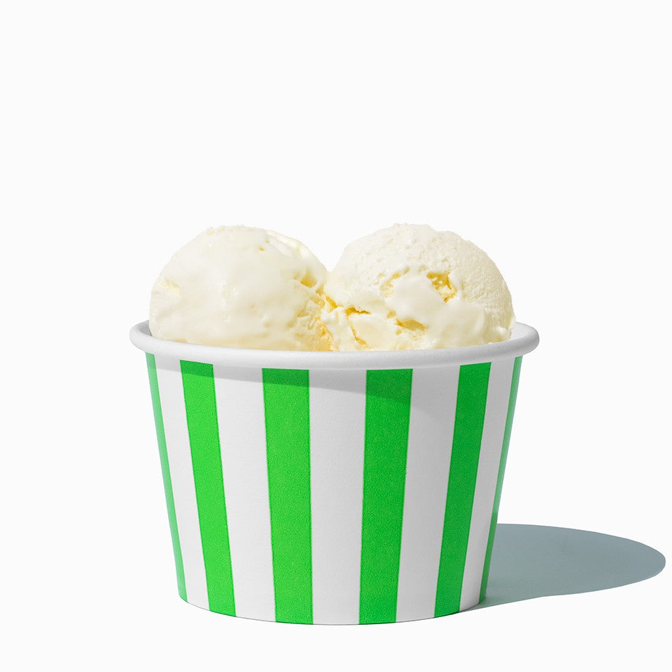 Close-up of 8 oz green ice cream cups stacked and ready to serve