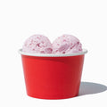 Close-up of 8 oz red ice cream cups stacked and ready to serve