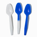 Close-up of assorted tasting spoons stacked and ready to serve