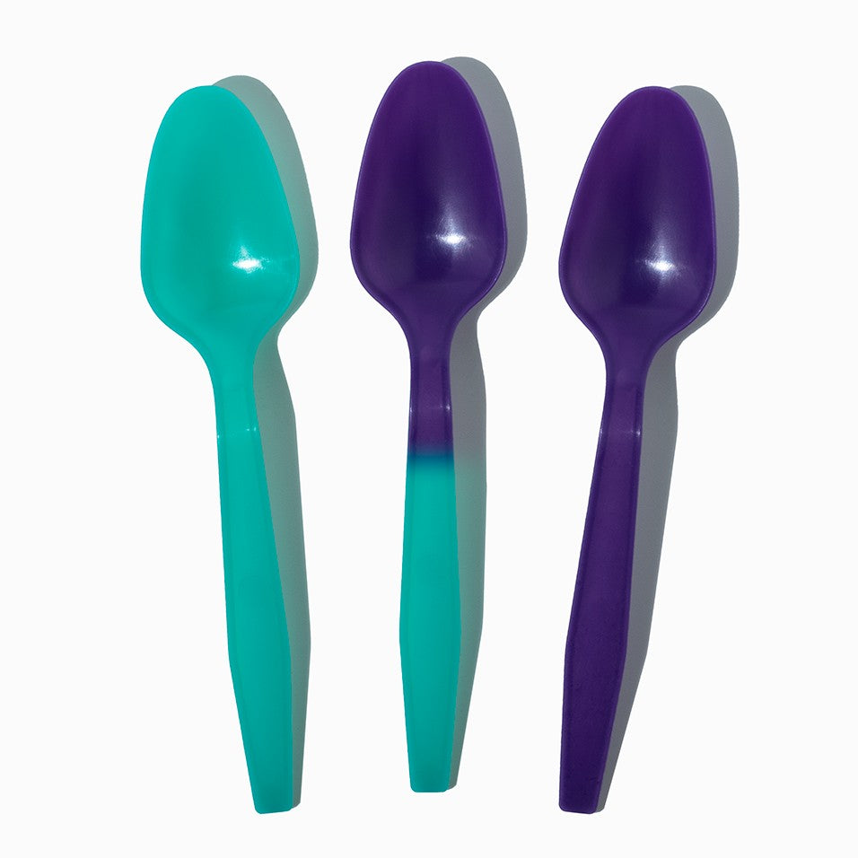 Close-up of assorted tasting spoons stacked and ready to serve