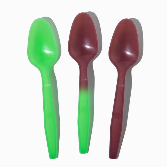 Close-up of assorted tasting spoons stacked and ready to serve