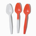 Close-up of assorted tasting spoons stacked and ready to serve