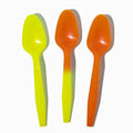 Close-up of assorted tasting spoons stacked and ready to serve