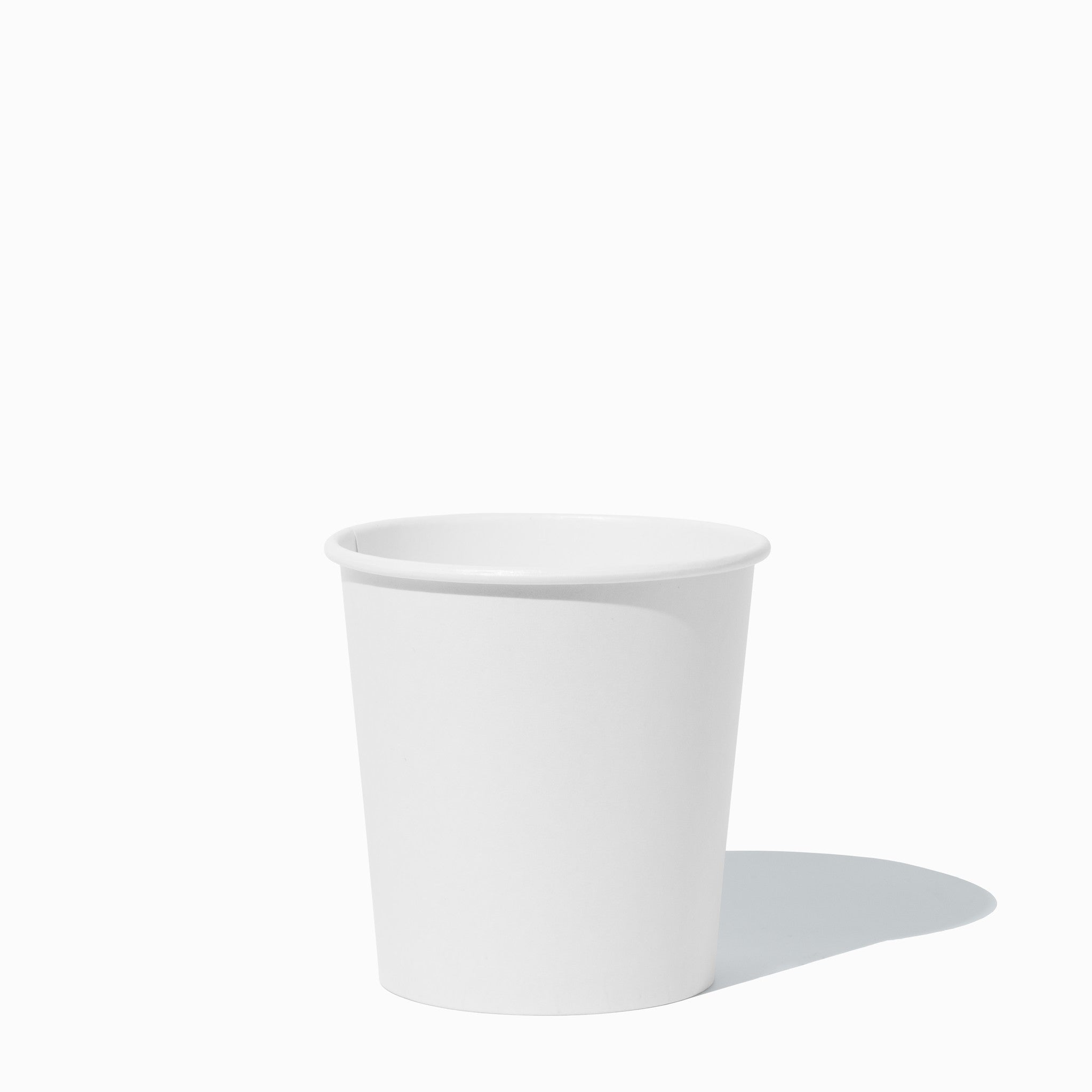 Close-up of 1 Pint white compostable to-go containers stacked and ready to serve